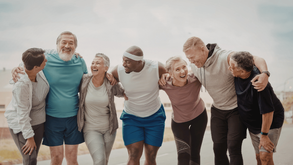Caregiver walking with an older adult outdoors
